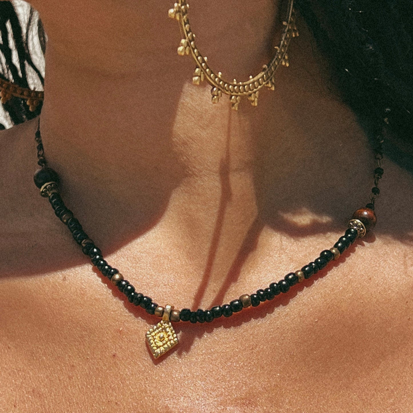 Model wearing the Akila Beaded and Brass Necklace