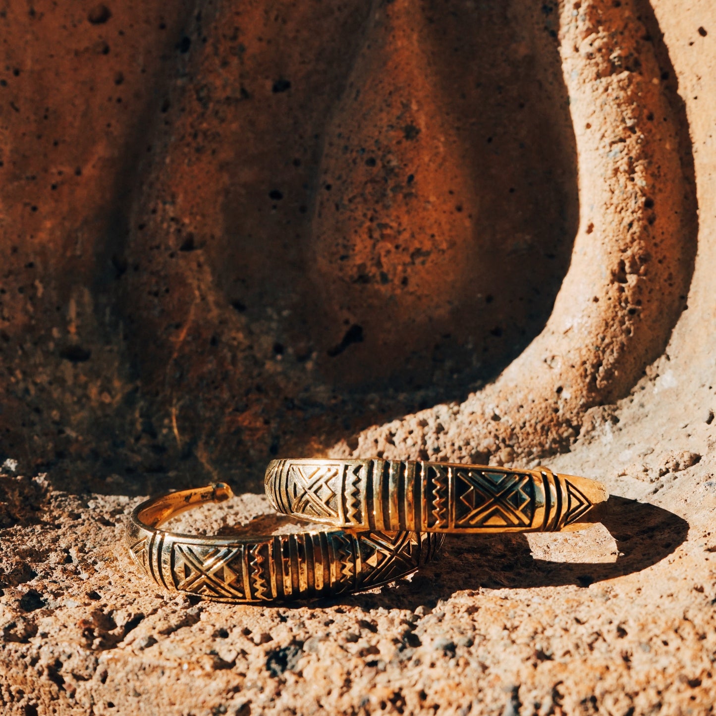 Brass Etched Cuffs on a Concrete Pillar